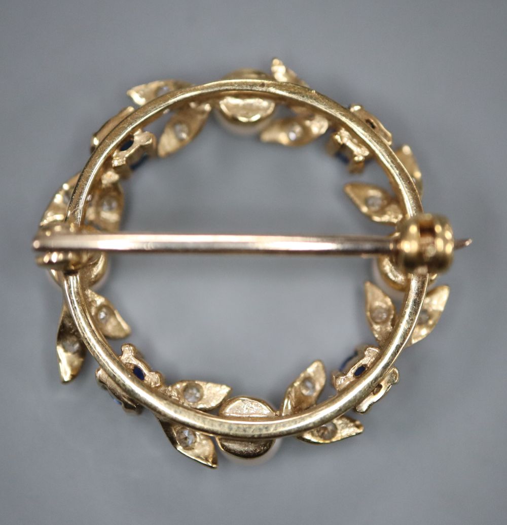 A modern 9ct gold, cultured pearl, sapphire and diamond set openwork brooch, 24mm, gross 4.1 grams.